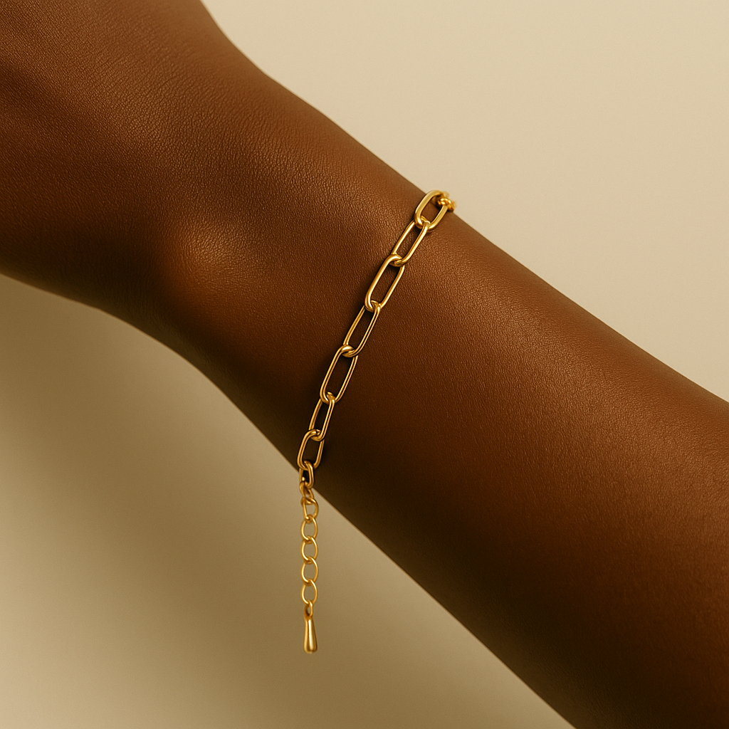 black woman wearing 14k gold paperclip bracelet – minimalist gold chain style by glowvy
