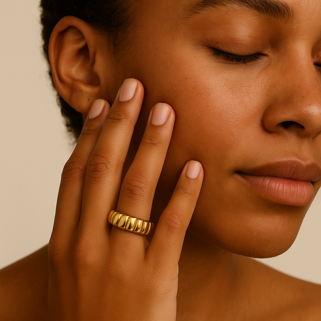 black woman wearing chunky gold statement ring – thick 14k wave design | Glowvy