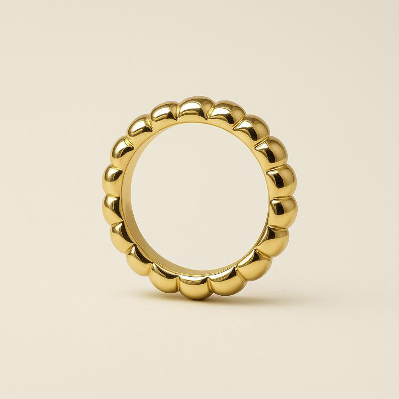 close-up of chunky gold ring with wave pattern – thick 14k plated band | Glowvy