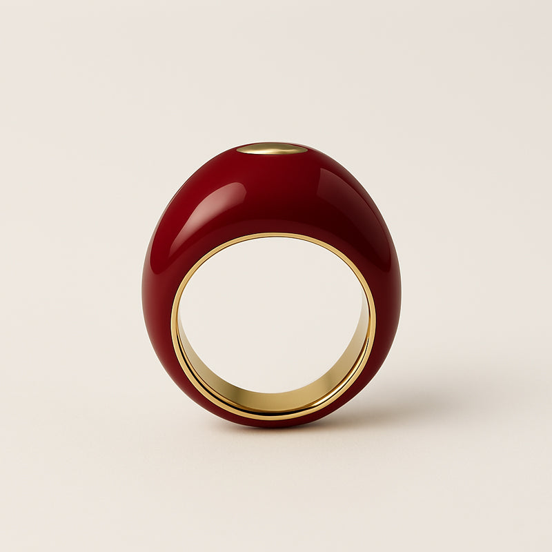 close-up of red enamel gold ring – smooth glossy finish | Glowvy
