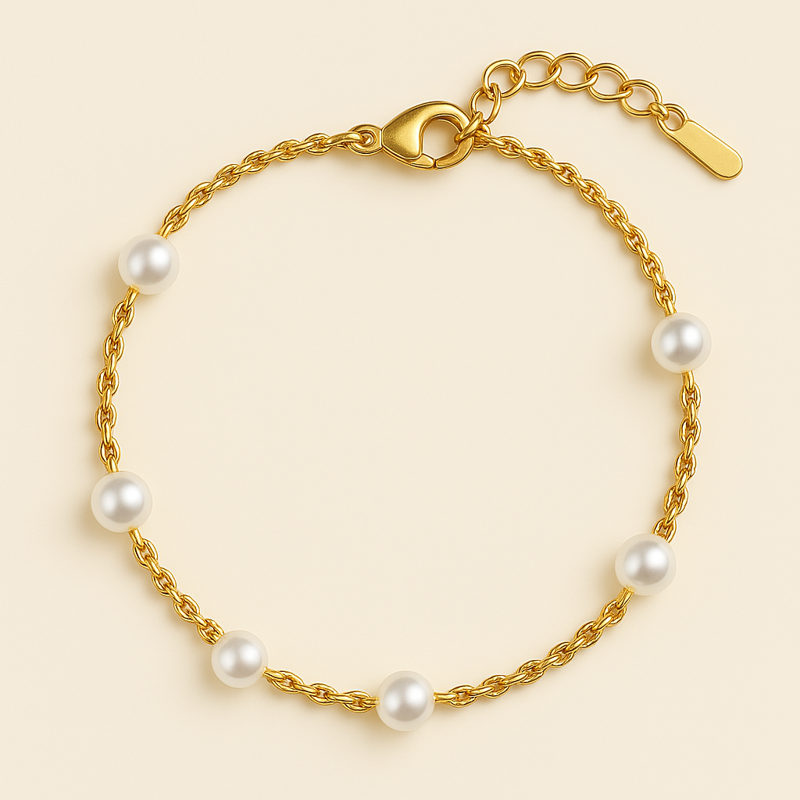 pearl and gold bracelet – 14k gold plated stainless steel with faux pearls on oat beige background

