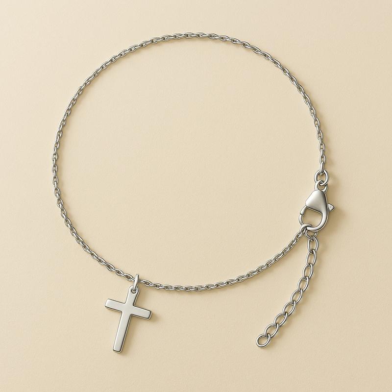 stainless steel cross necklace in silver – minimalist pendant on neutral oat background
