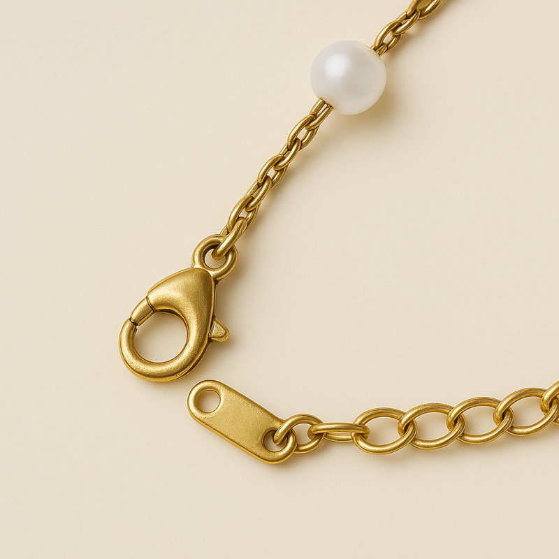 close-up of faux pearl and gold bracelet – 14k gold finish with smooth pearl beads

