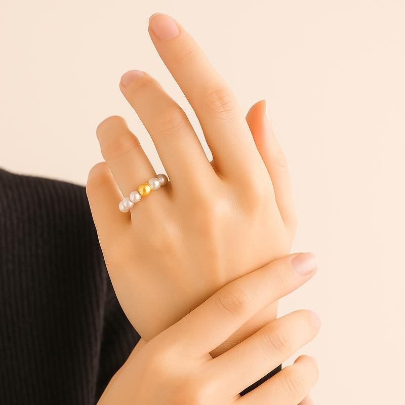 white woman modeling delicate freshwater pearl stacking ring – simple beaded design | Glowvy
